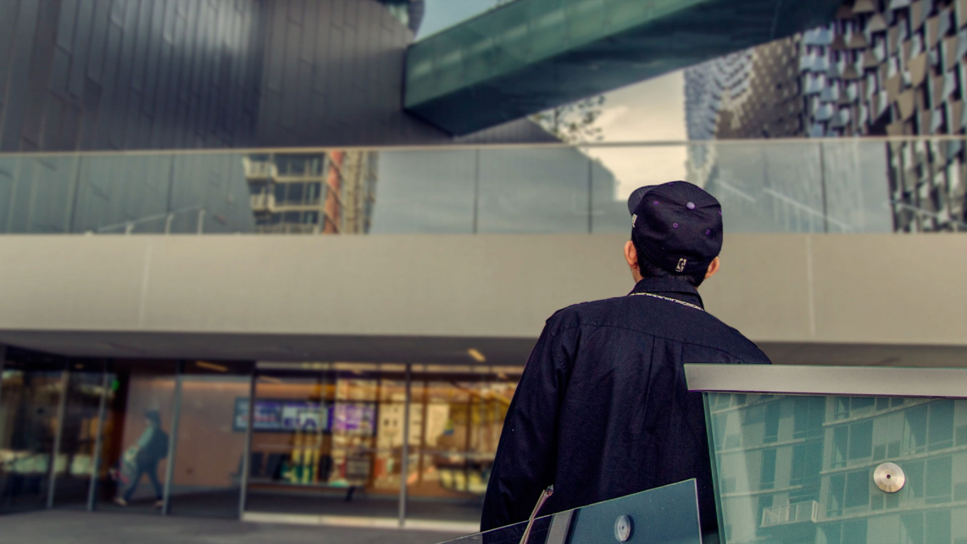 A student looking up at a building