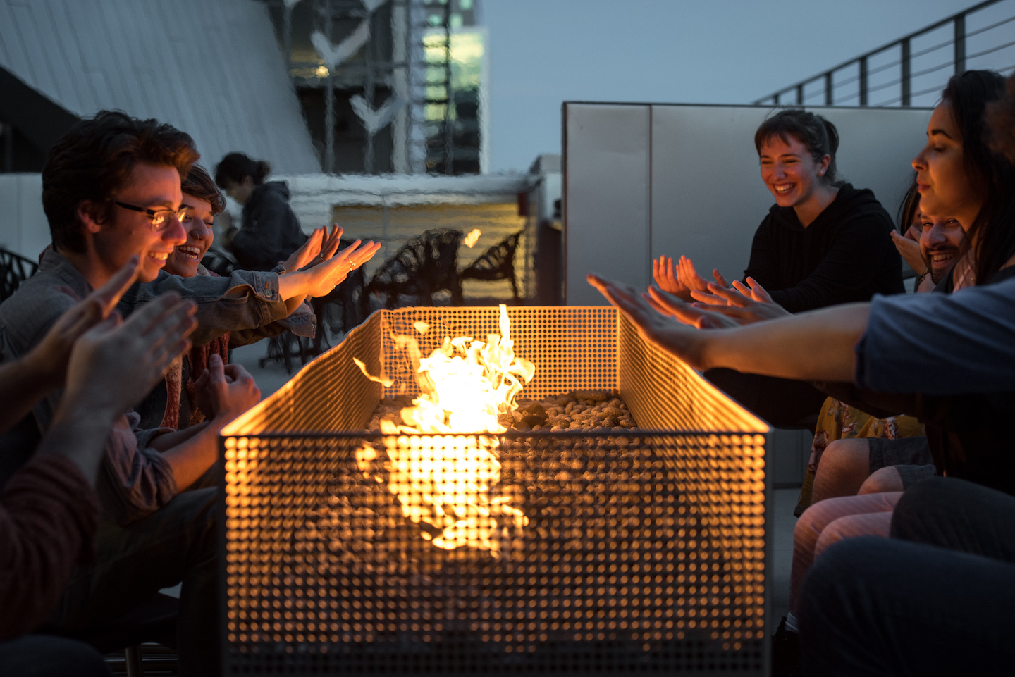 Emerson Los Angeles students sitting around bonfire on campus