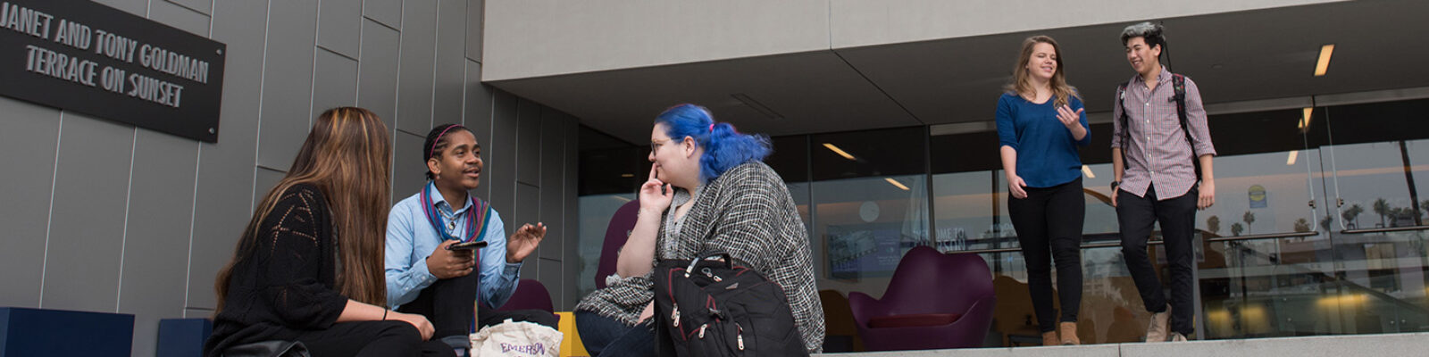 Group of students sitting outside on steps at Emerson Los Angeles